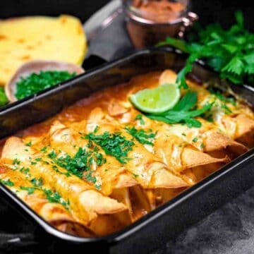 Mexican enchiladas in a baking dish.