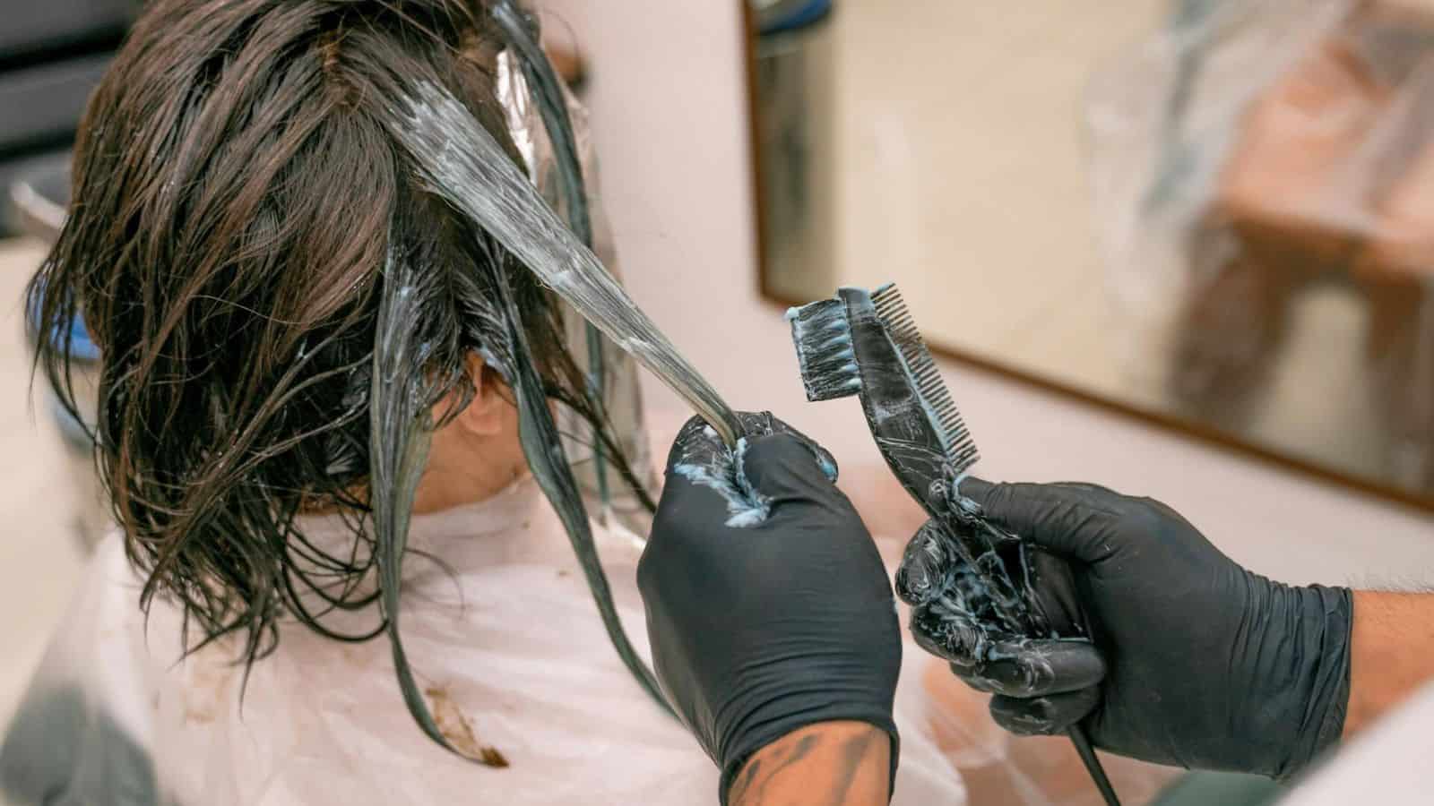 Woman getting her hair dyed at a salon