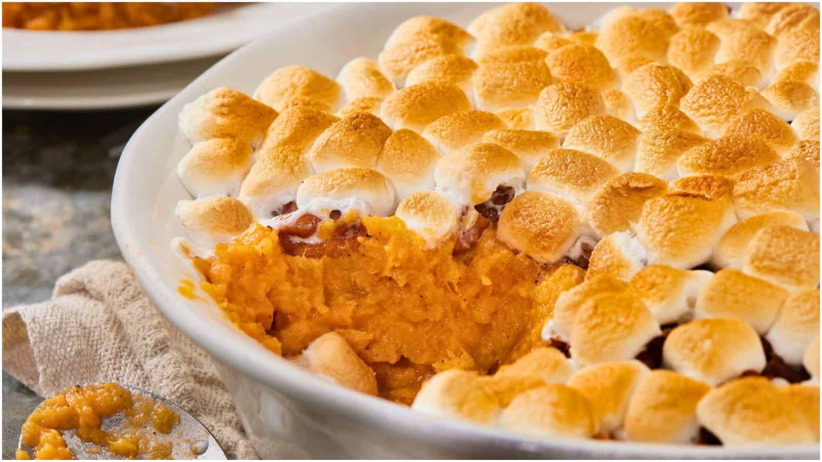 Close-up photo of a sliced Sweet Potato Casserole with Marshmallows