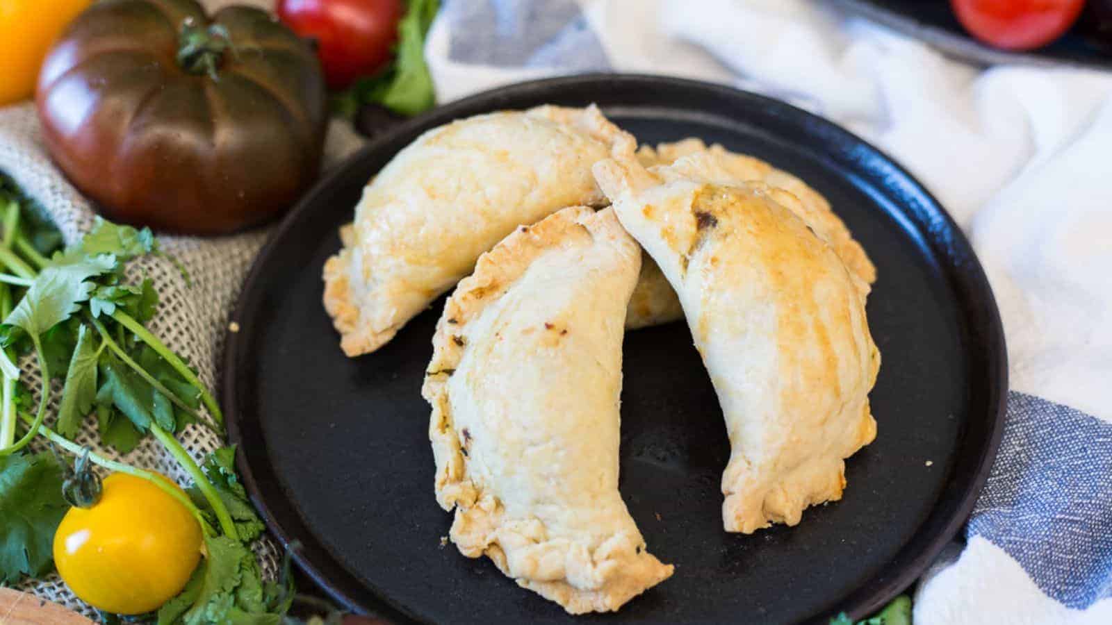 Cheesy Balkan bourekas with eggplant and tomatoes.