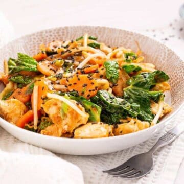 Bowl of chicken chop suey with fork.