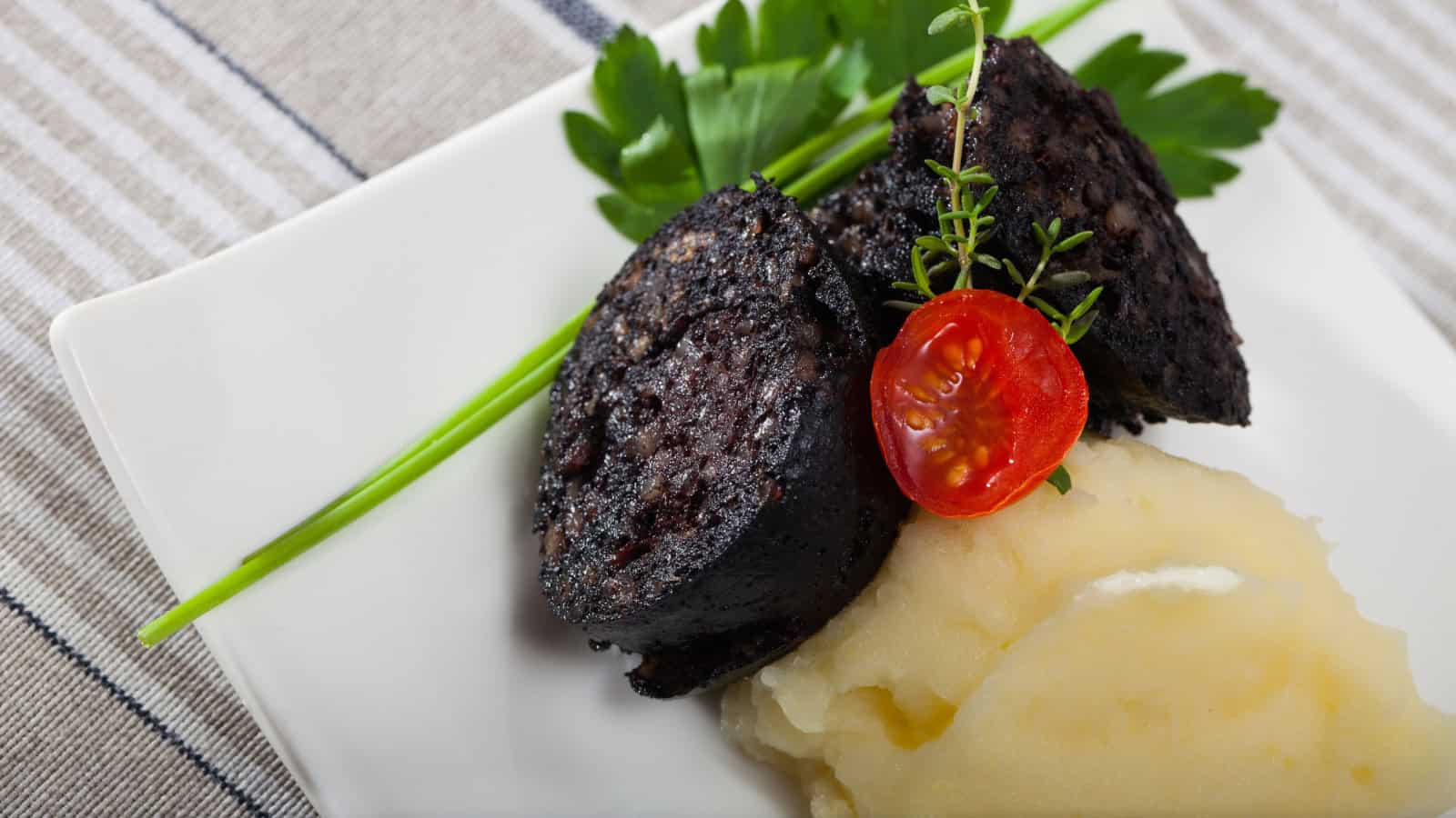Slices of Boudin Noir. and tomato