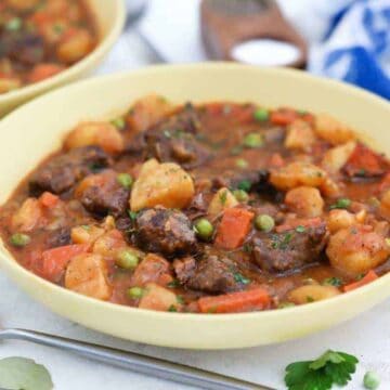 Beef stew in yellow bowls.