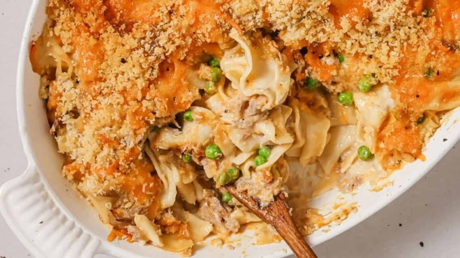 A casserole dish filled with pasta and peas.