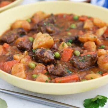 Beef stew in yellow bowls.