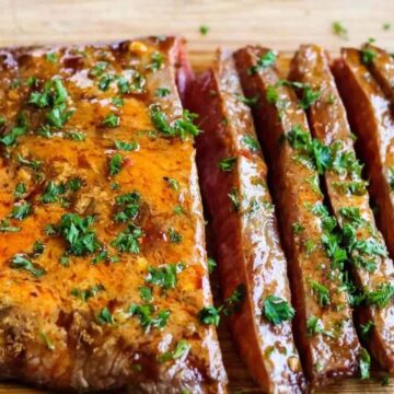 Sliced flank steak with chili butter.