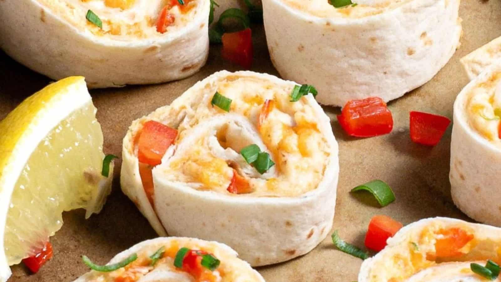 Crab pinwheels arranged neatly on a plate.
