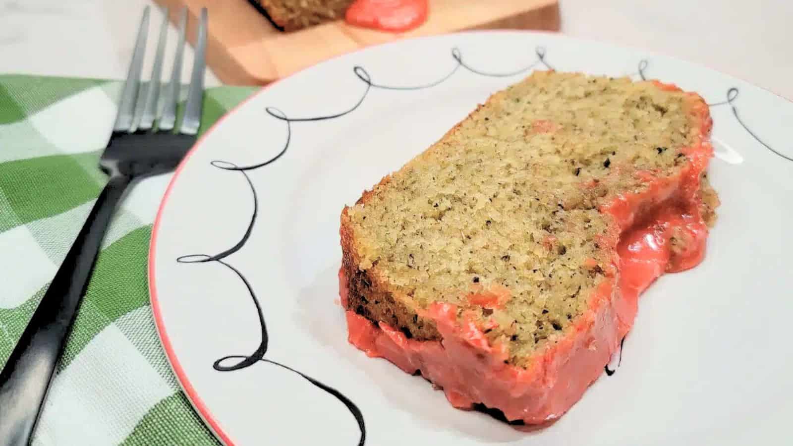 A slice of lavender chamomile cake on a decorative plate.