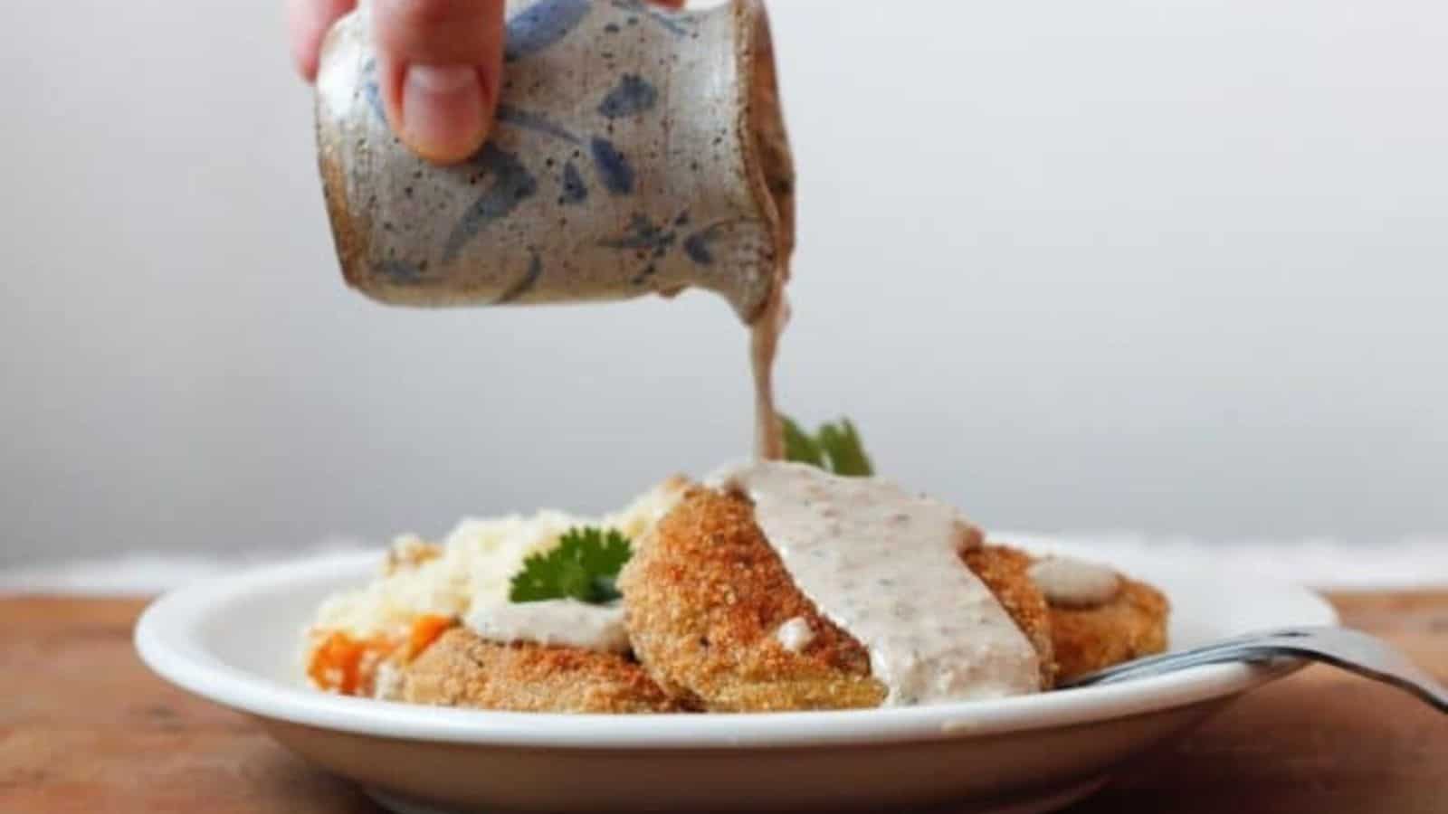 Three patties on a plate with rice.
