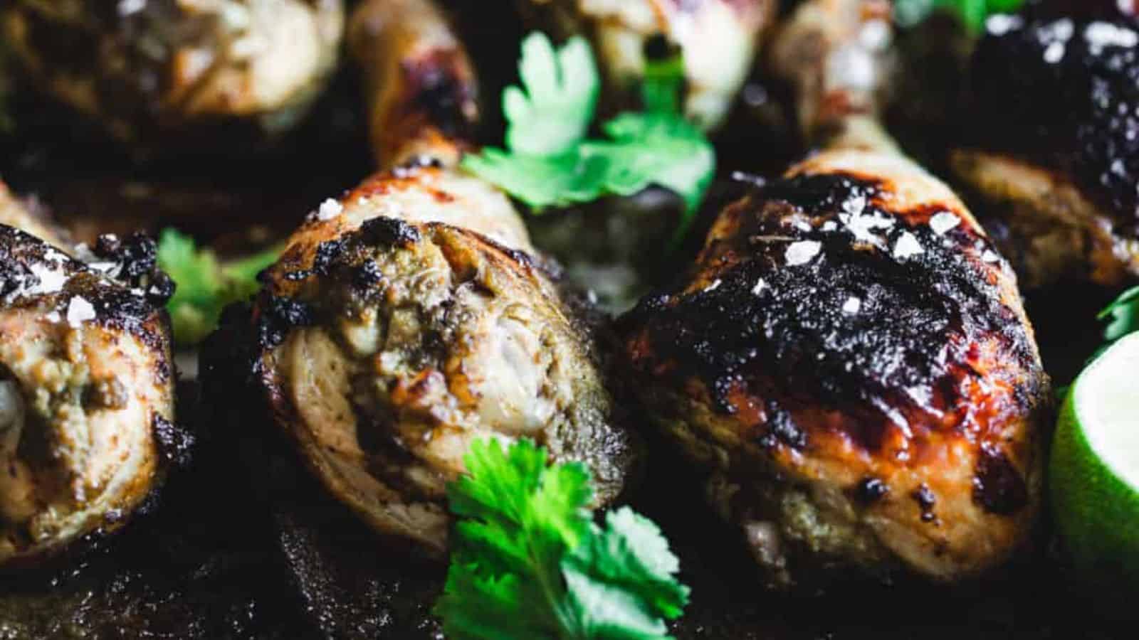 Chicken drumsticks on a plate.