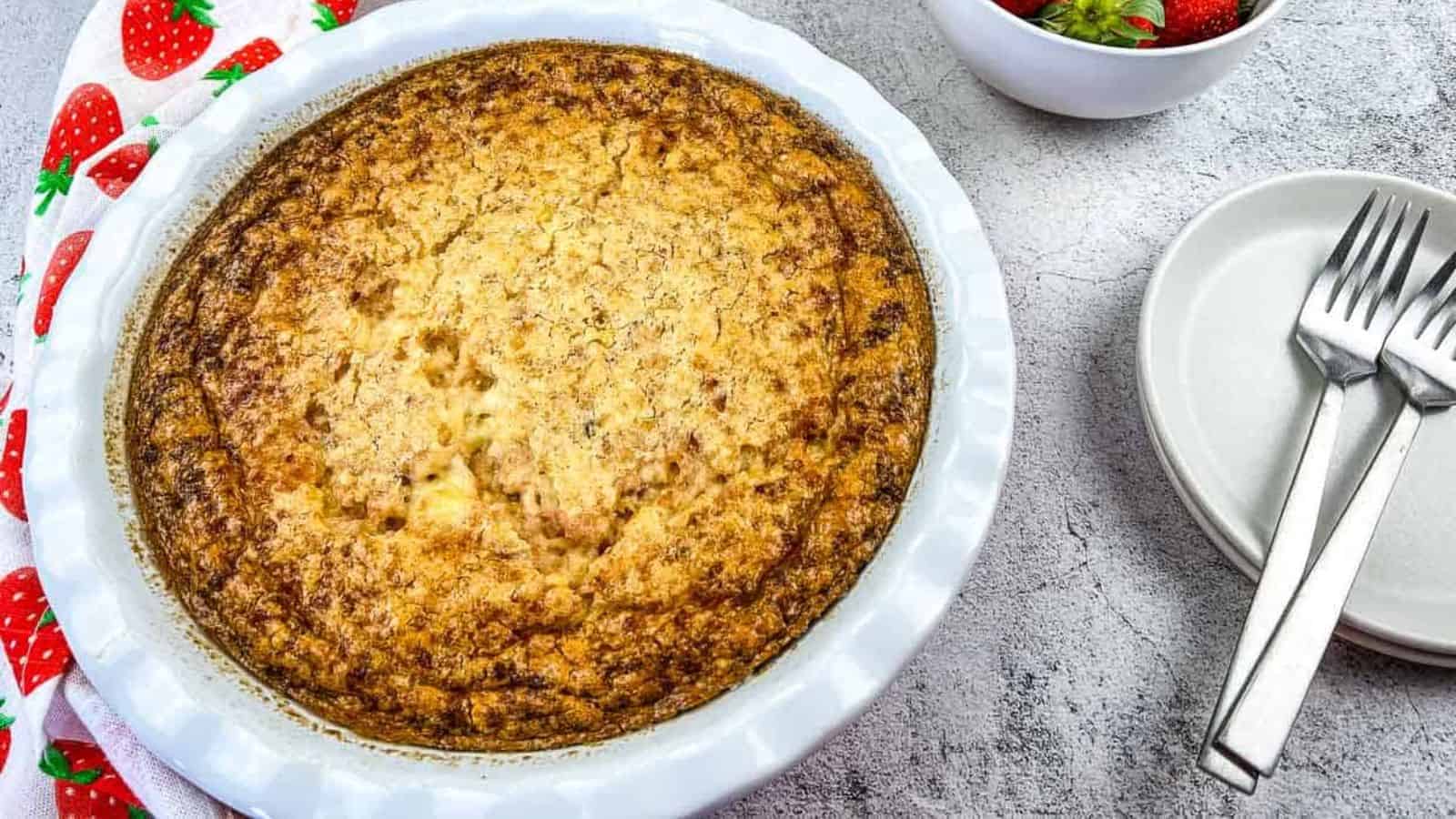 Slices of Ham & Cheese Impossible Quiche next to a whole pie.