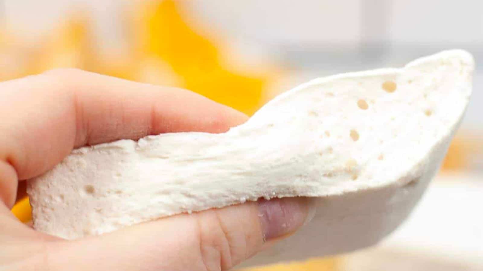 Hand squeezing homemade marshmallows.