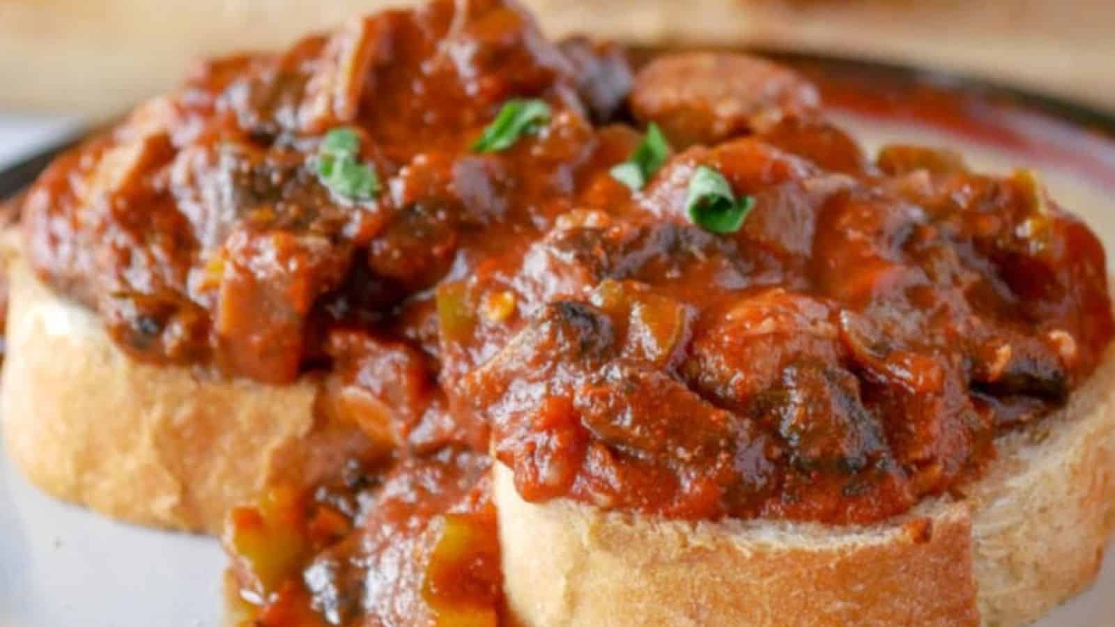 Top view of a big pot of mushroom stew with cheese and basil on a cutting board next to the pot.