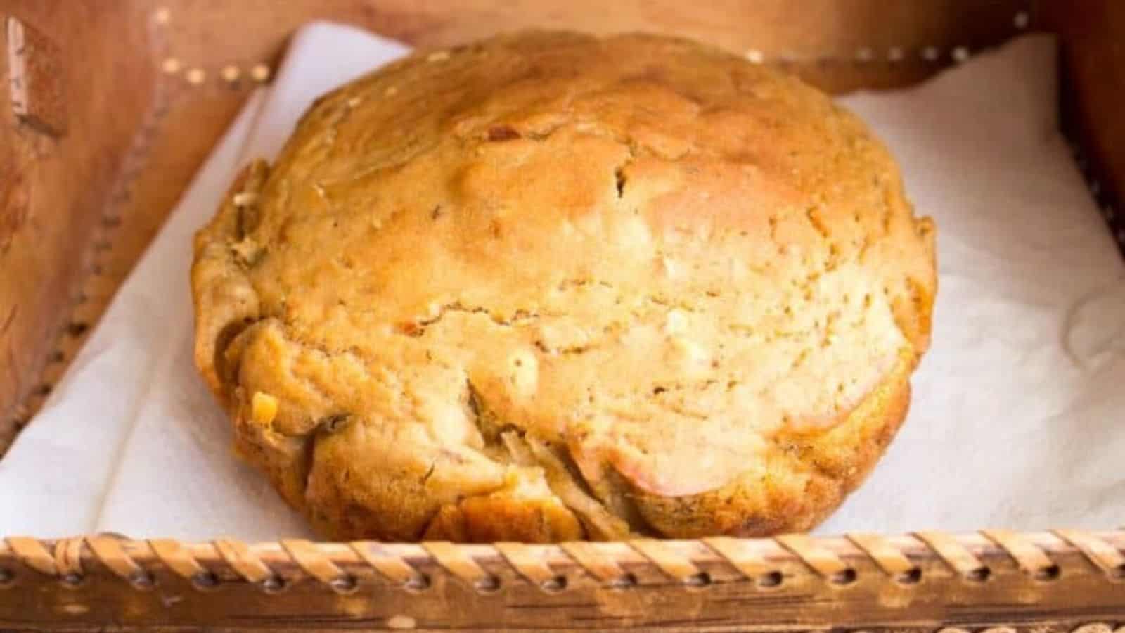 A loaf of bread is sitting on a tray.