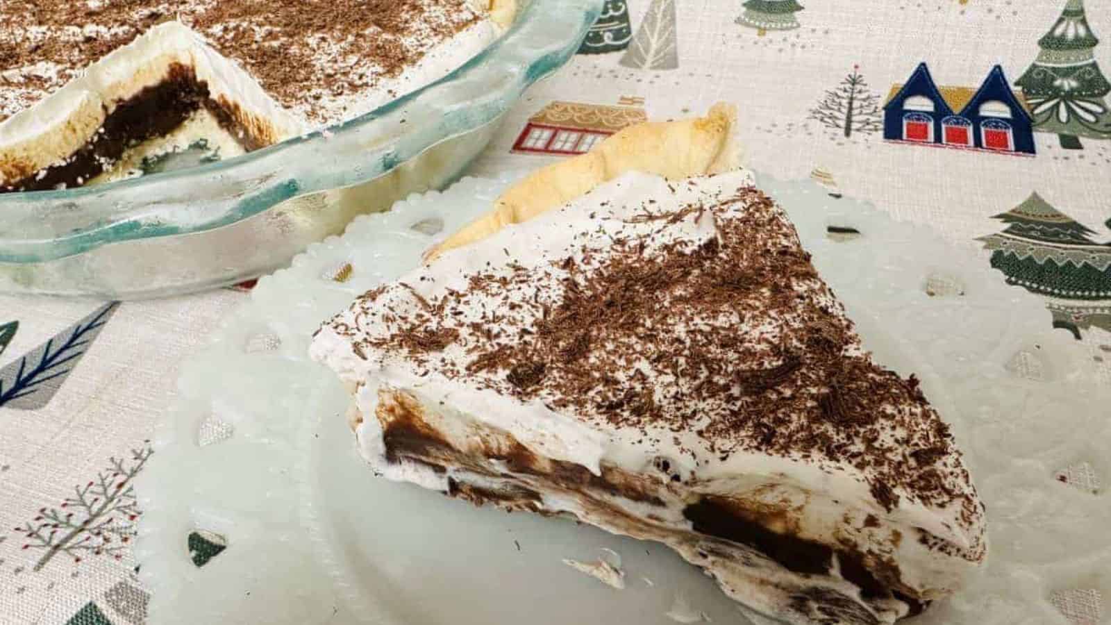 A slice of chocolate cream pie on a plate.