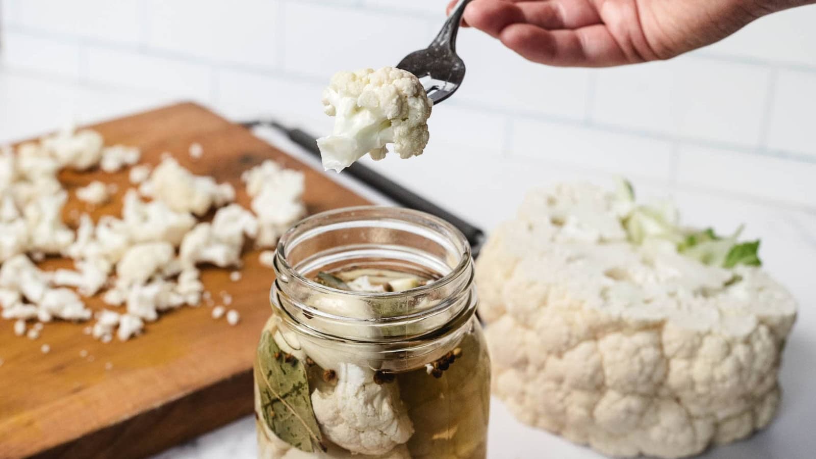 Jar of pickled cauliflower with spices.