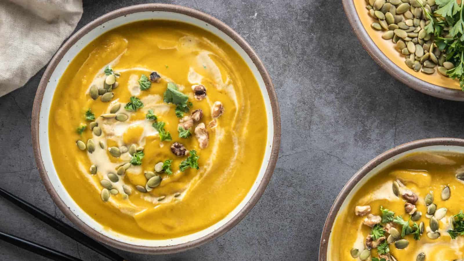 An overhead image of spicy pumpkin soup served in a bowl.