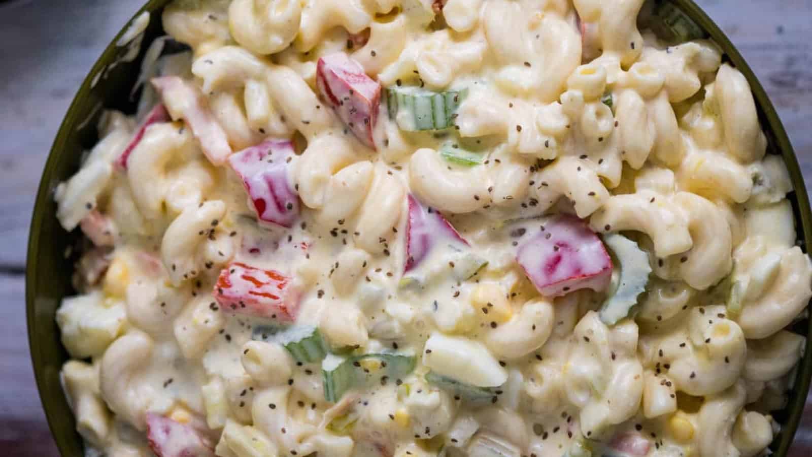Bowl of Amish macaroni salad with some on a spoon.