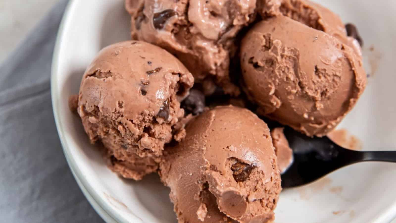 Chocolate Chocolate Chip Ice Cream in a white bowl with a spoon.