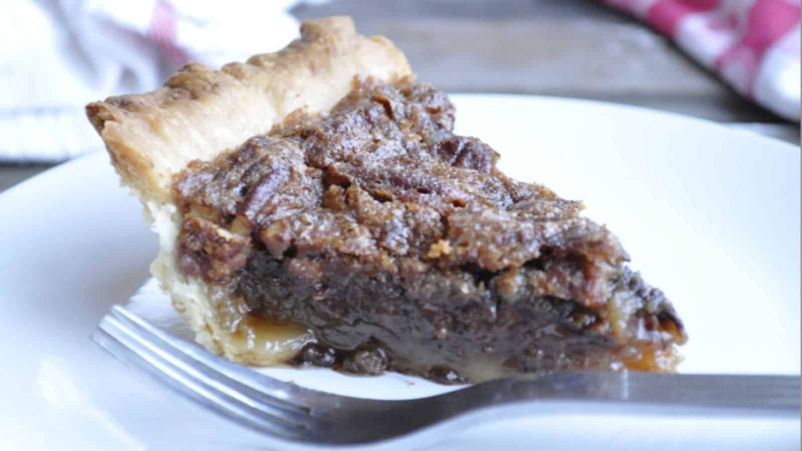 A slice of chocolate pecan pie.