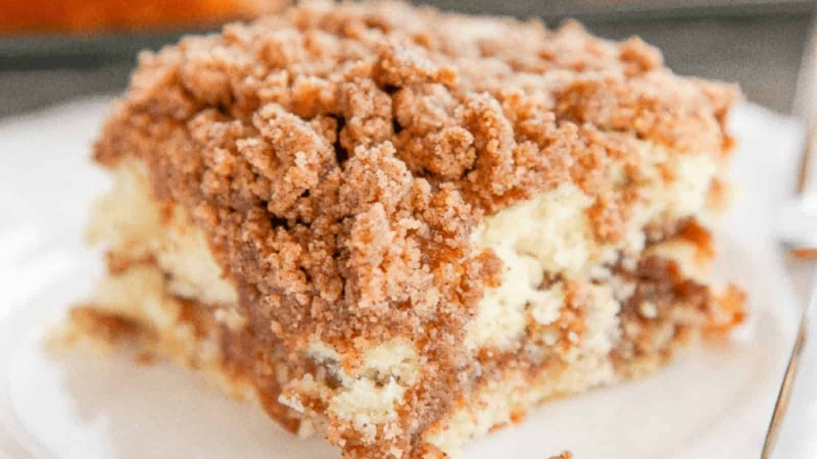 A slice of cinnamon coffee cake topped with brown sugar streusel.