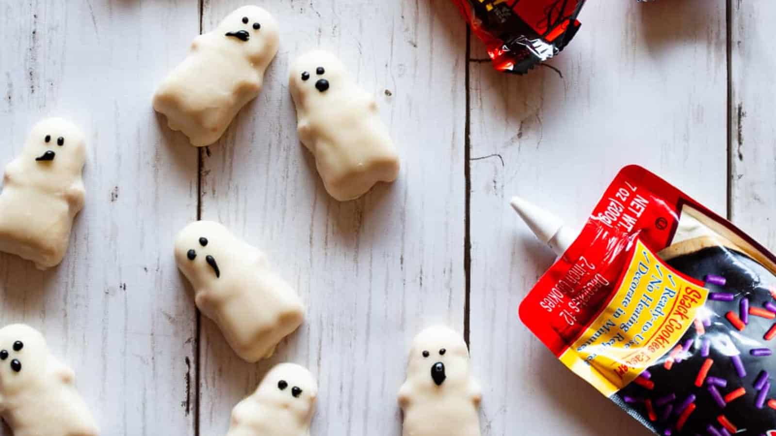 Making faces on Reese's Peanut Butter Ghosts.