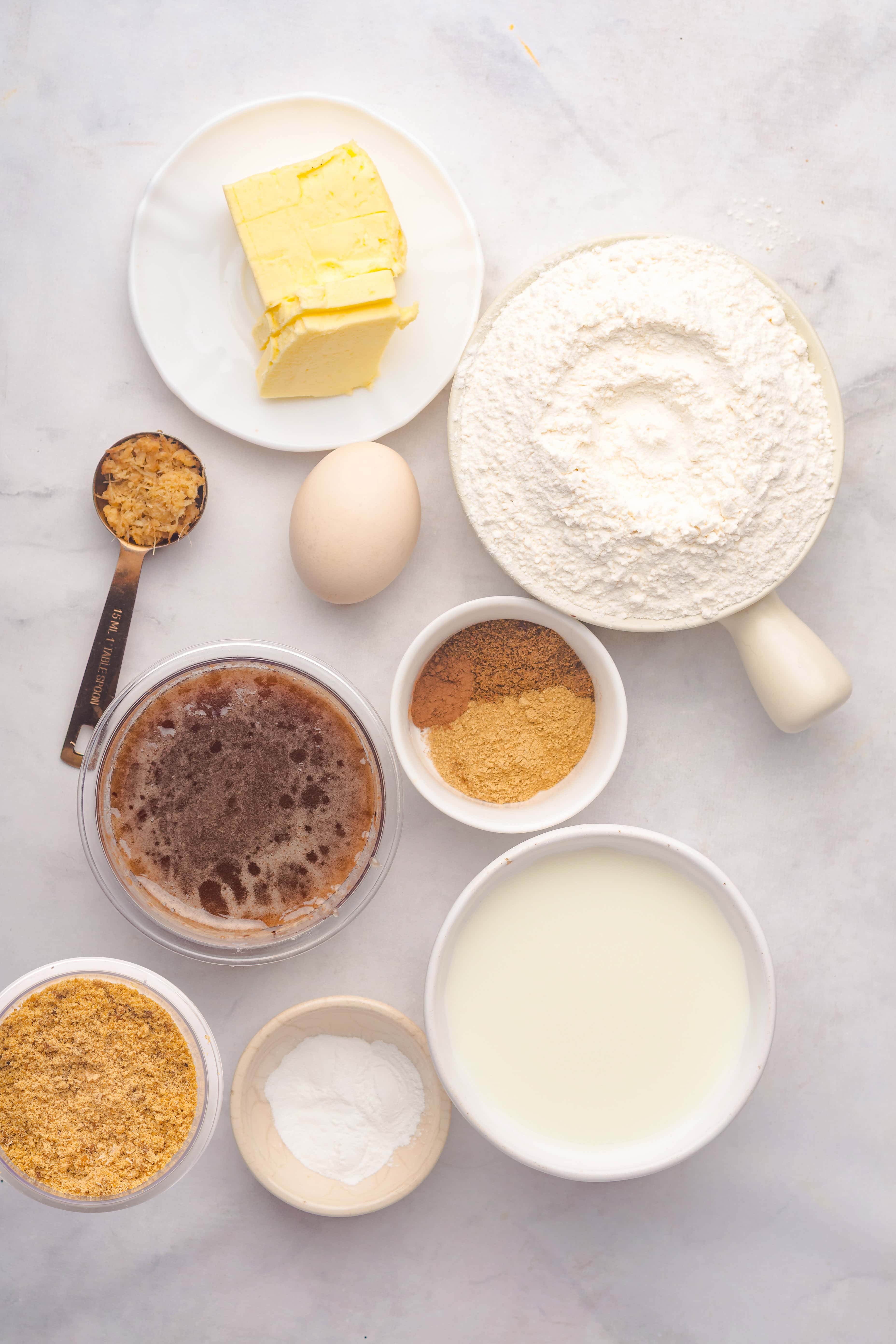 A group of bowls of flour and butter ready for baking a delicious Gingerbread Loaf.