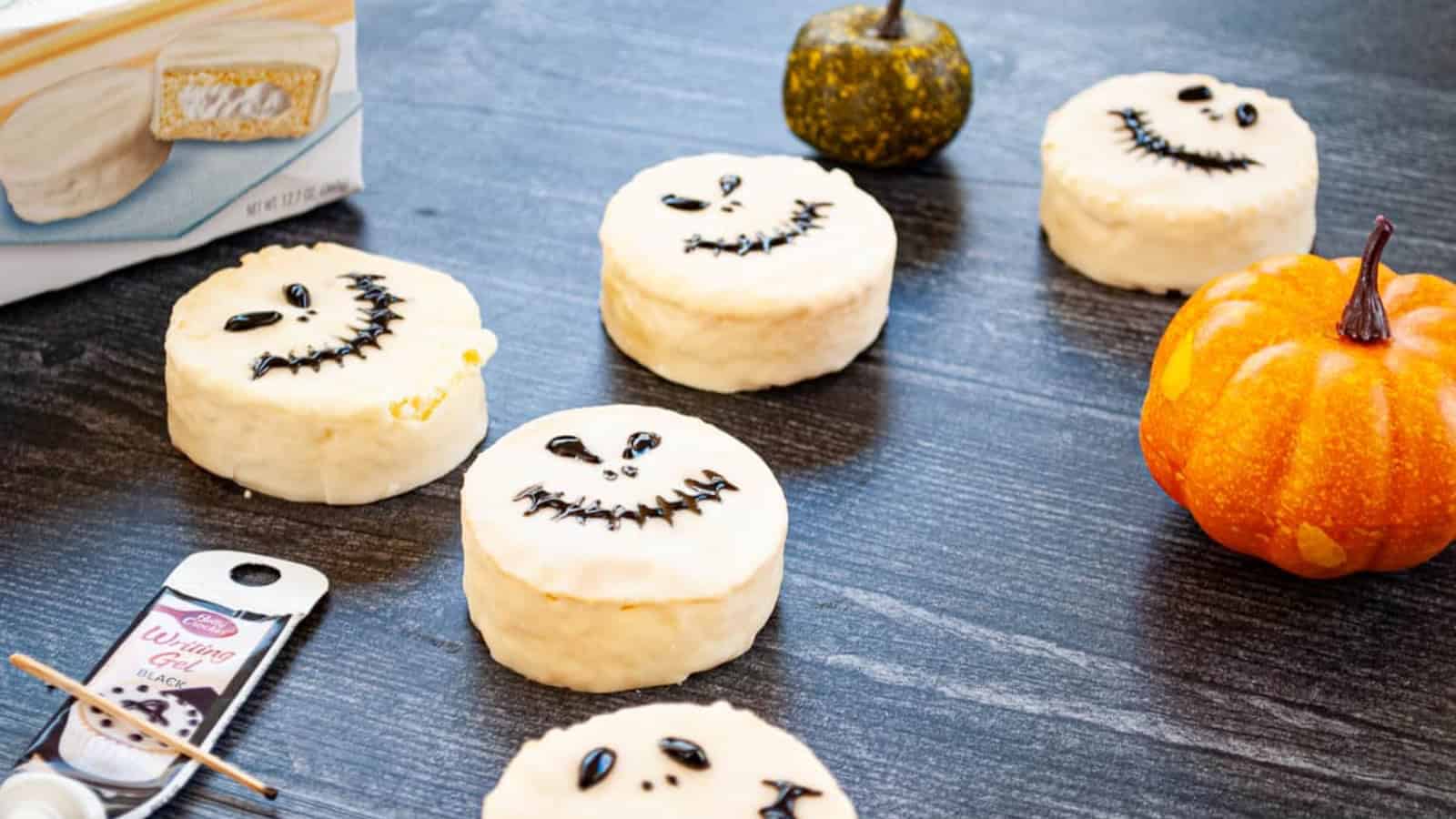 White fudge ding dongs decorated with Jack Skellington's face.