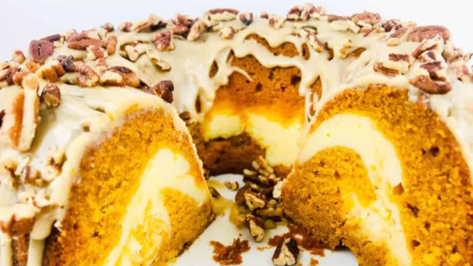 Pumpkin bundt cake with a slice missing.