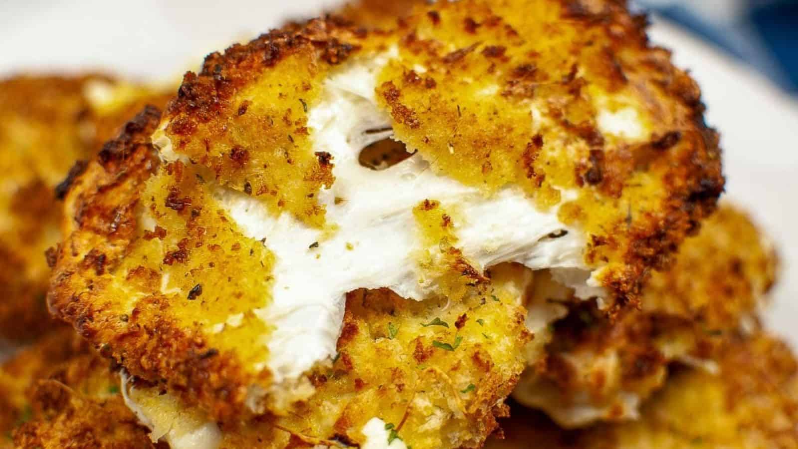 Close-up of golden, crispy roasted cauliflower steak with a crunchy breadcrumb coating.