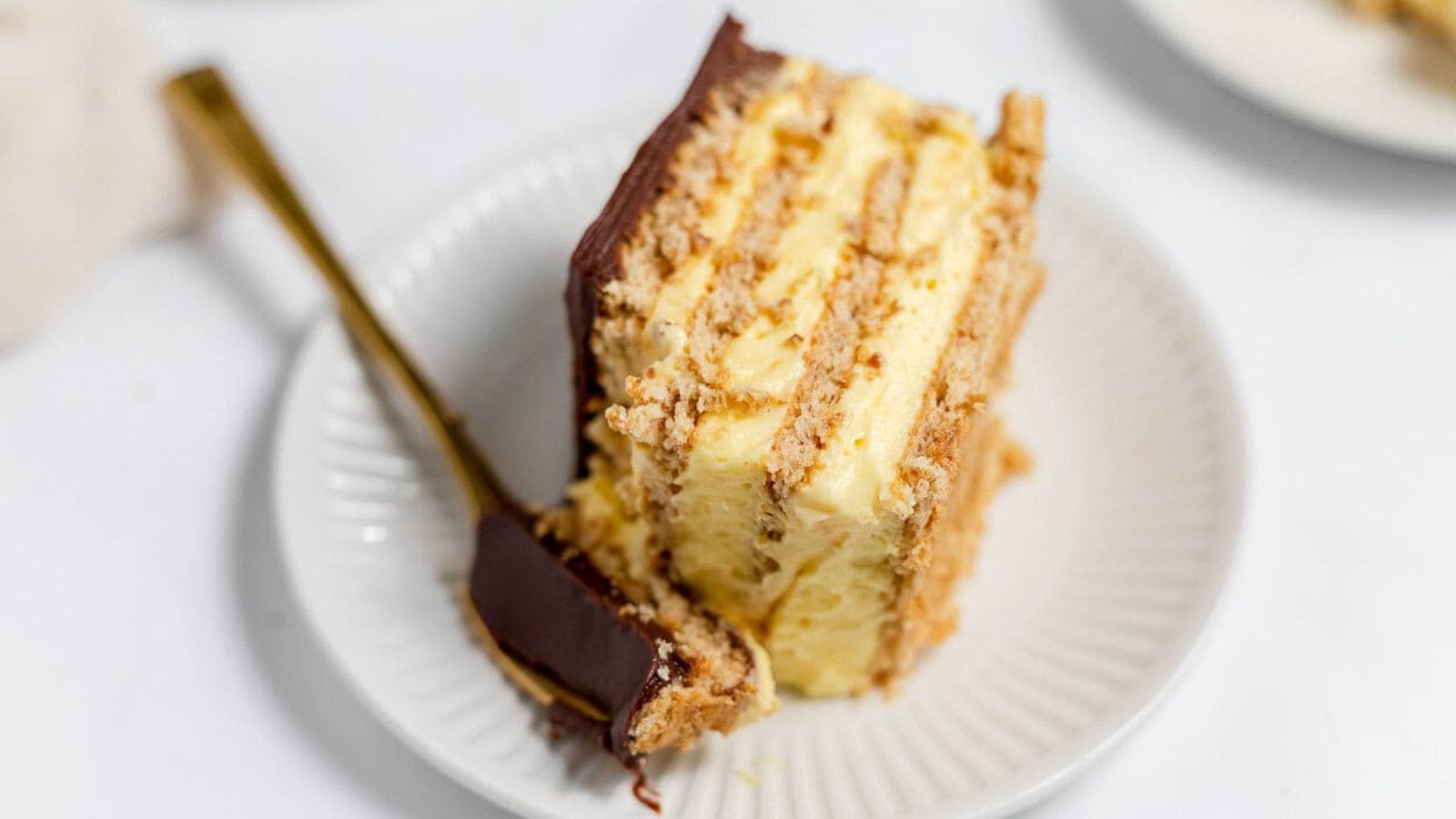 Slice of No-Bake &Eacute;clair Cake with layers. 
