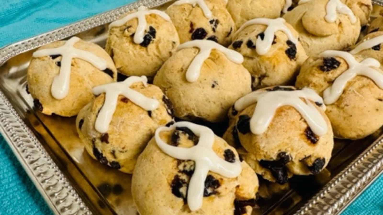 Hot cross buns on silver tray.