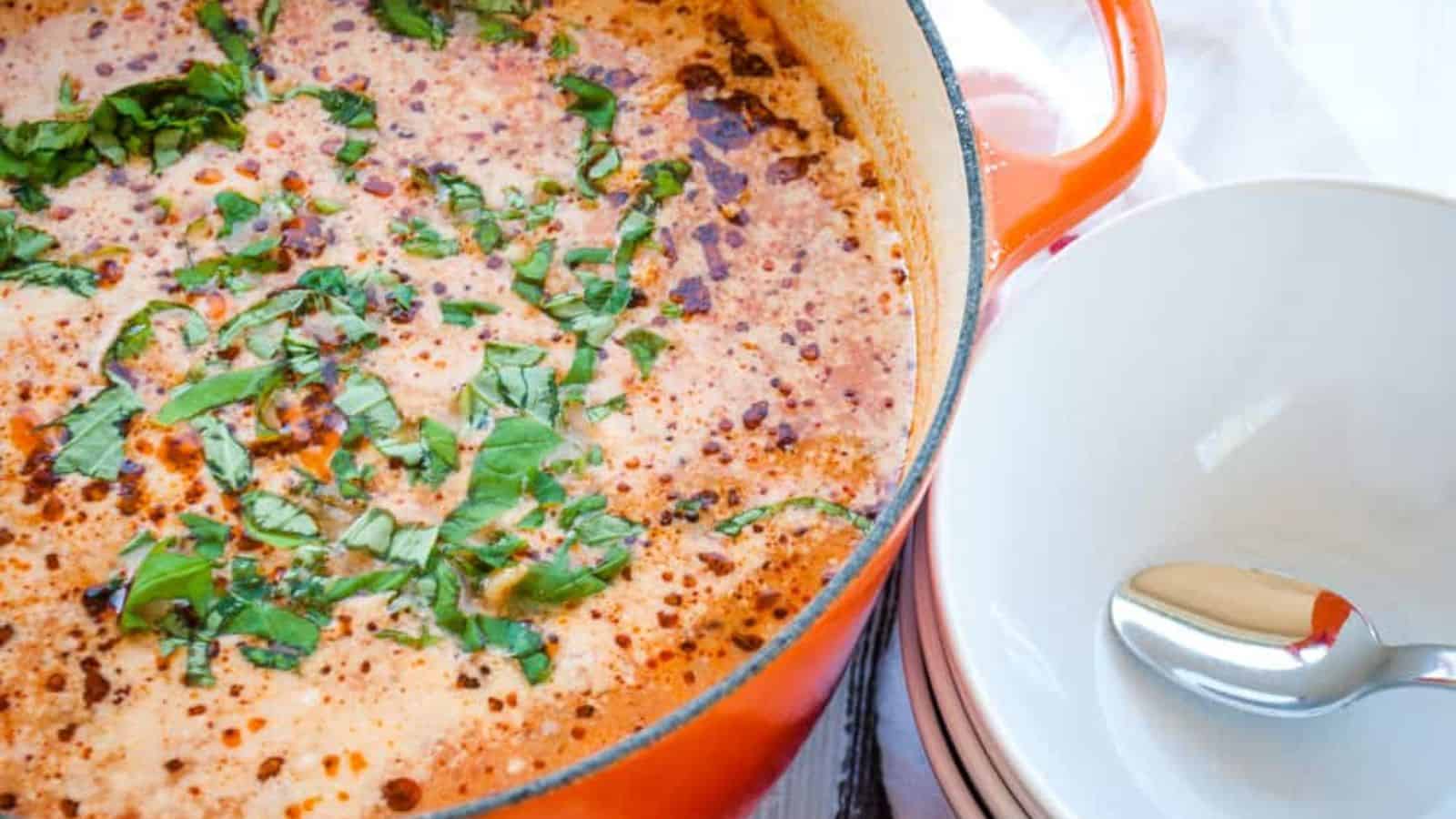 A warm pot of tomato soup, perfect for cozy winter dinners.