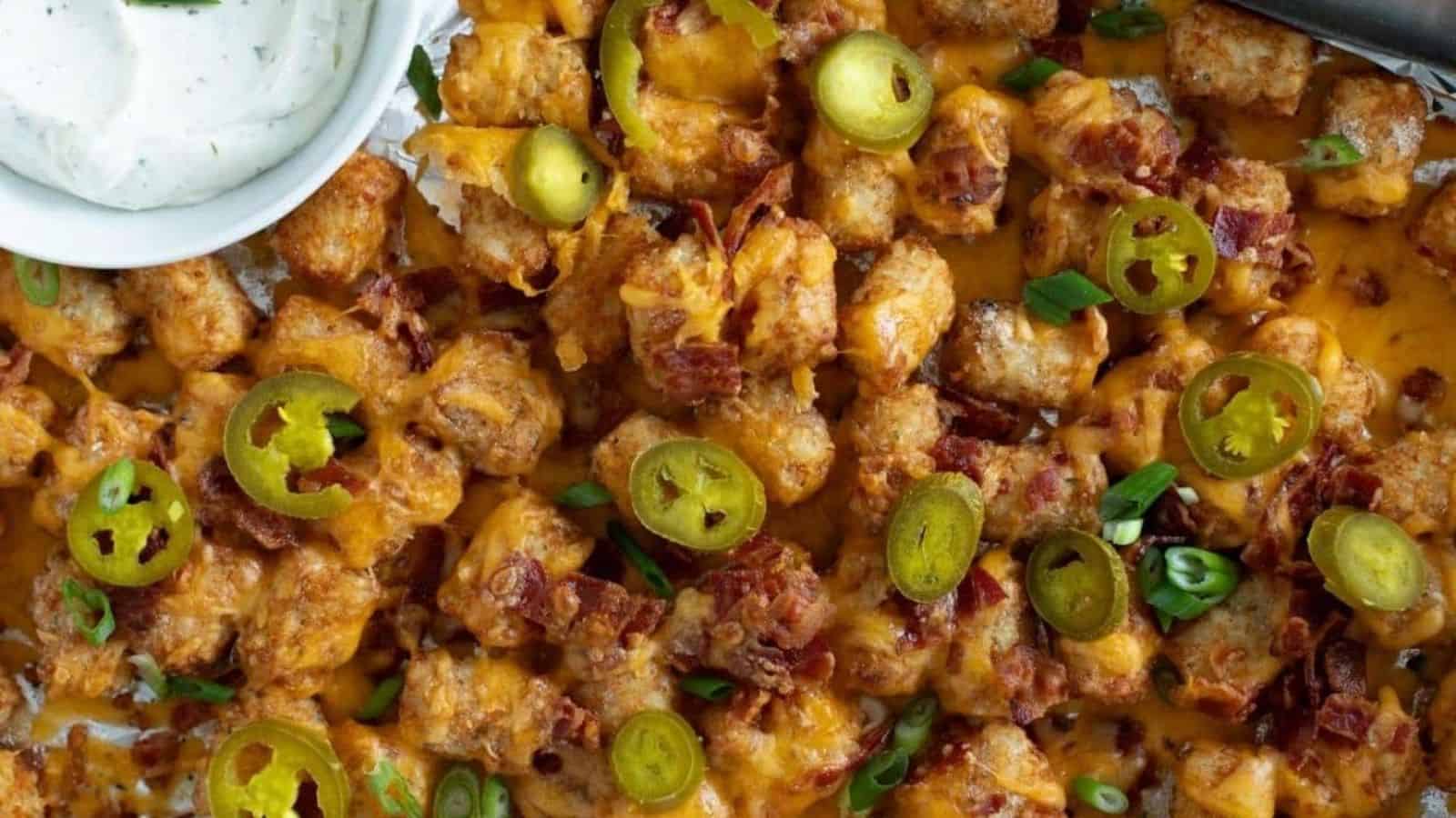 Loaded tater tots on sheet pan.