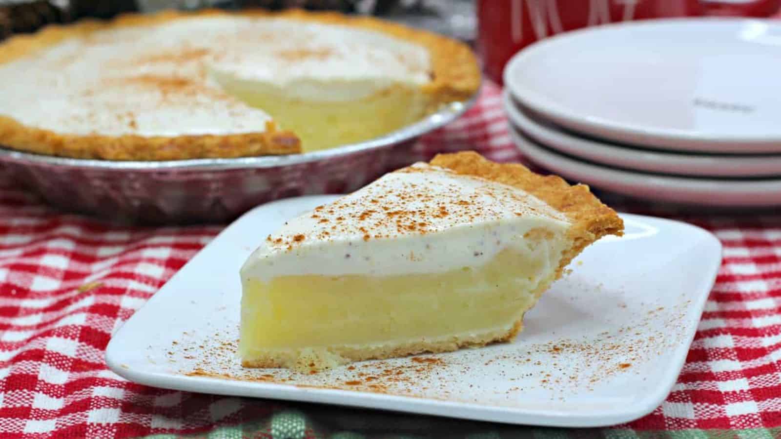 Slice of pie with a white layer on top.
