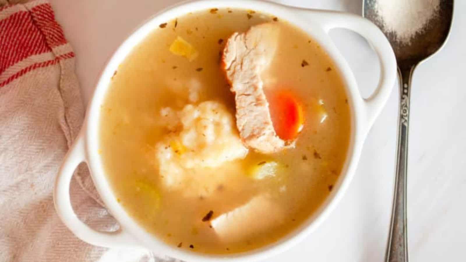 A bowl of turkey dumpling soup. 