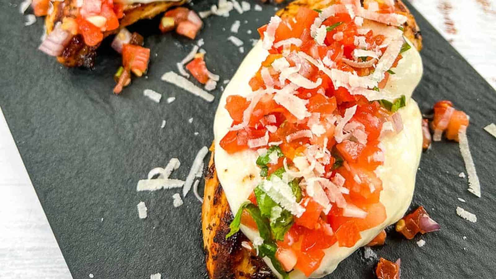 Grilled Bruschetta Chicken on a white plate.