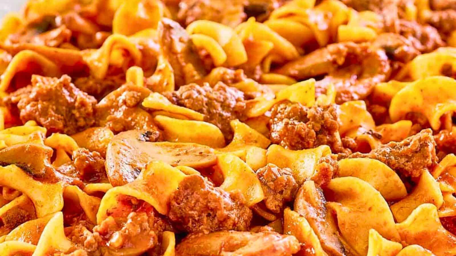 Close-up of American Goulash with egg noodles, ground beef, mushrooms, and creamy sauce.