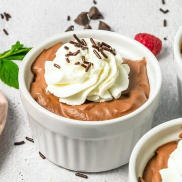 A group of desserts in ramekins, featuring rich Chocolate Mousse.