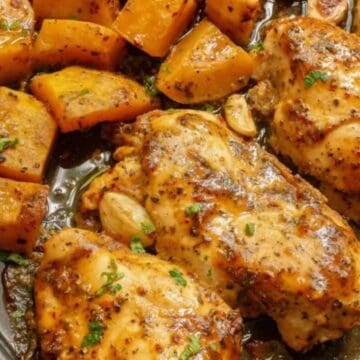 Easy dinners made simple: baked chicken breasts with herbs and roasted cubed potatoes on a baking tray.