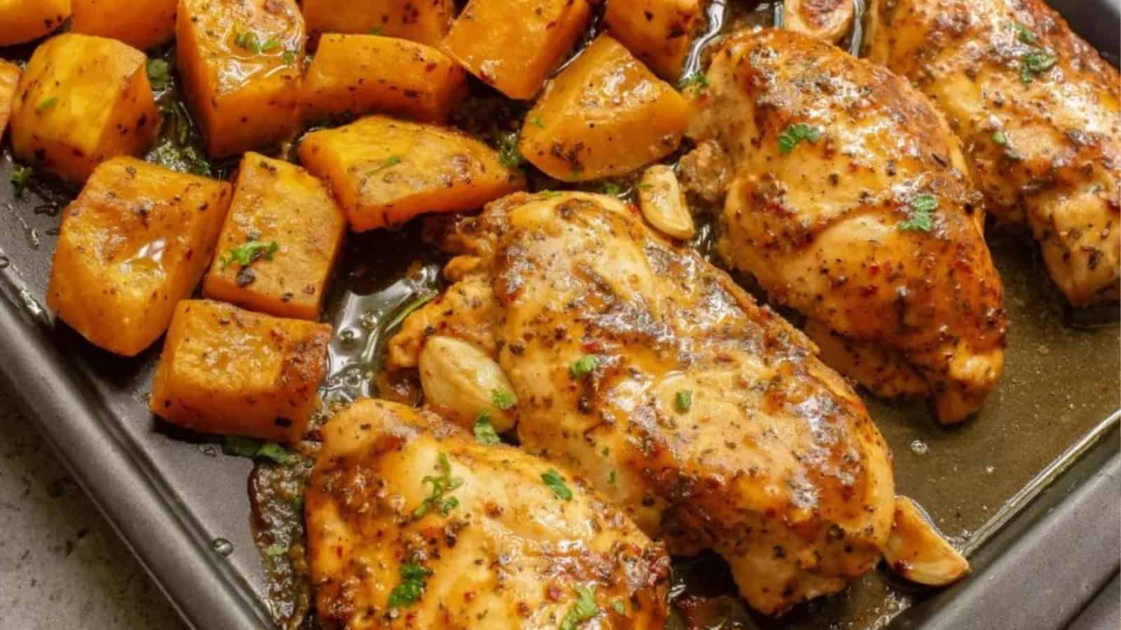 Easy dinners made simple: baked chicken breasts with herbs and roasted cubed potatoes on a baking tray.