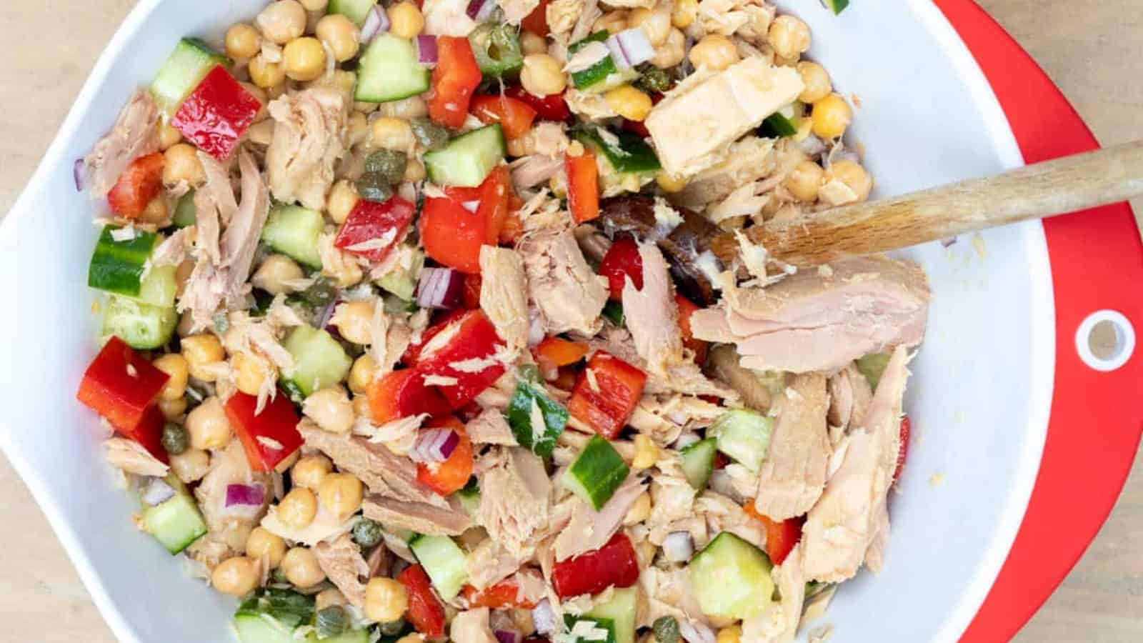 Chickpea tuna salad with chickpeas, tuna, herbs, and vegetables served in a bowl.