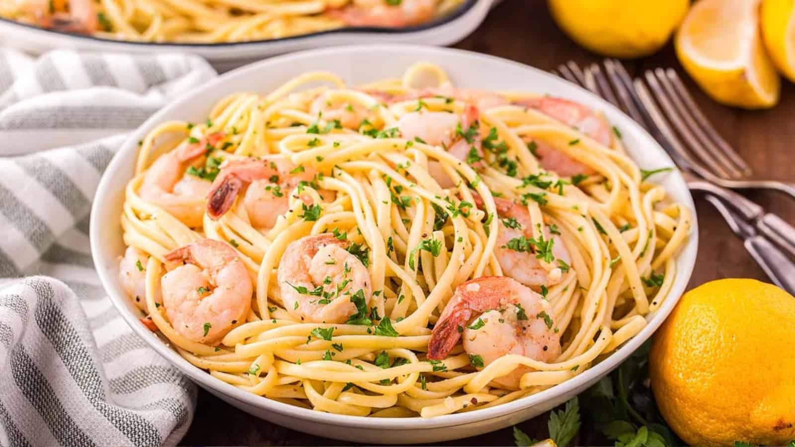 Shrimp linguine pasta tossed in a light sauce and garnished with herbs.