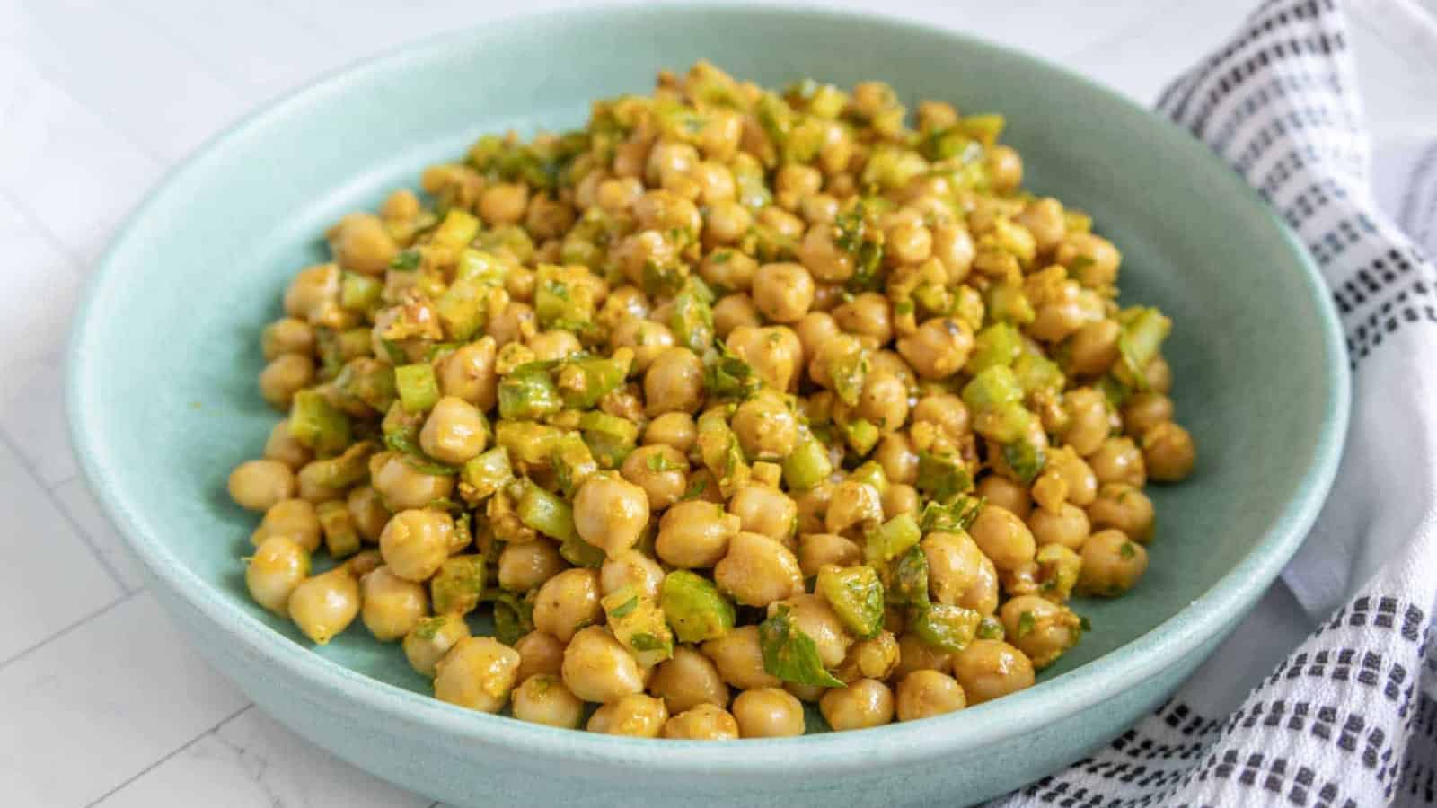Chickpea salad with chickpeas, vegetables, and herbs tossed in dressing.