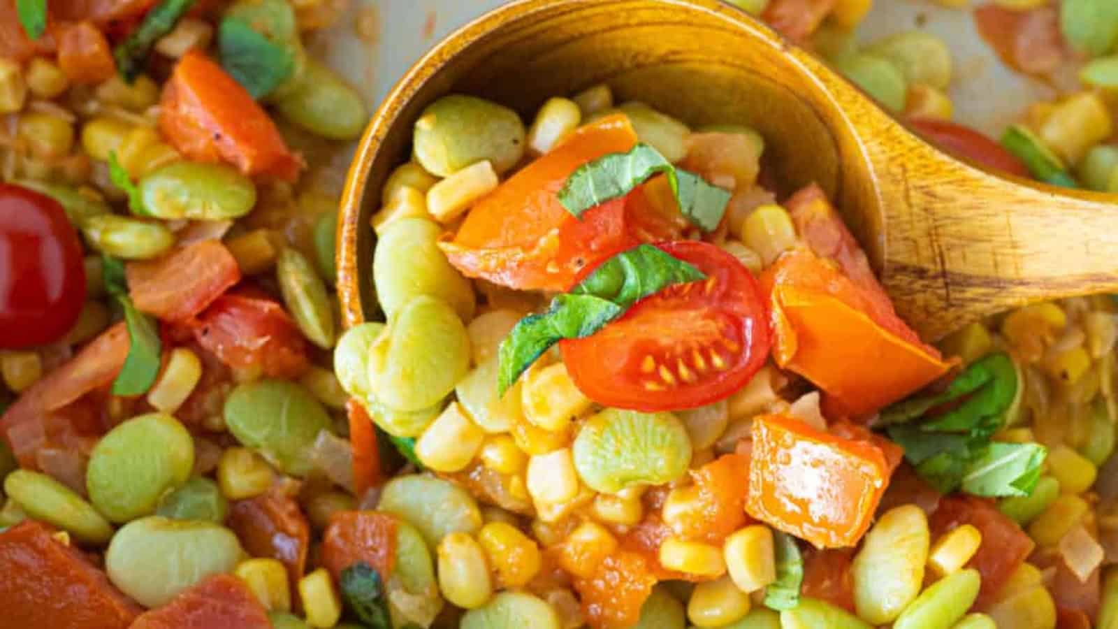 Succotash made with corn and lima beans sautéed together in a skillet.