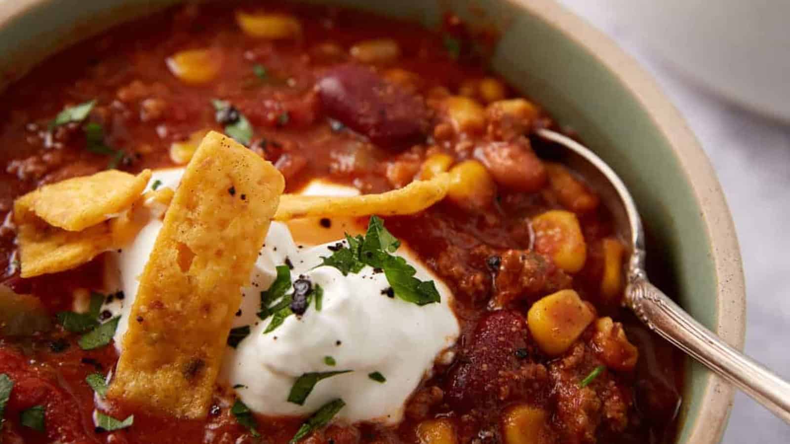 Delicious crockpot chili with beans, corn, and seasoned meat, perfect for easy, guilt-free dinners.