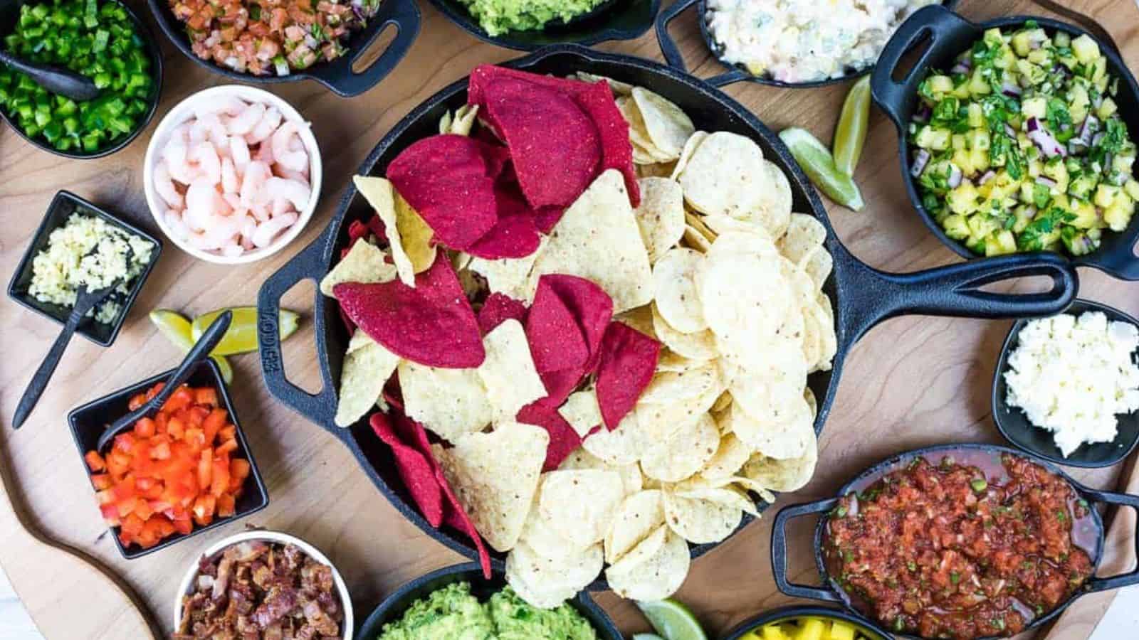 A top-down shot of a guacamole snack board.