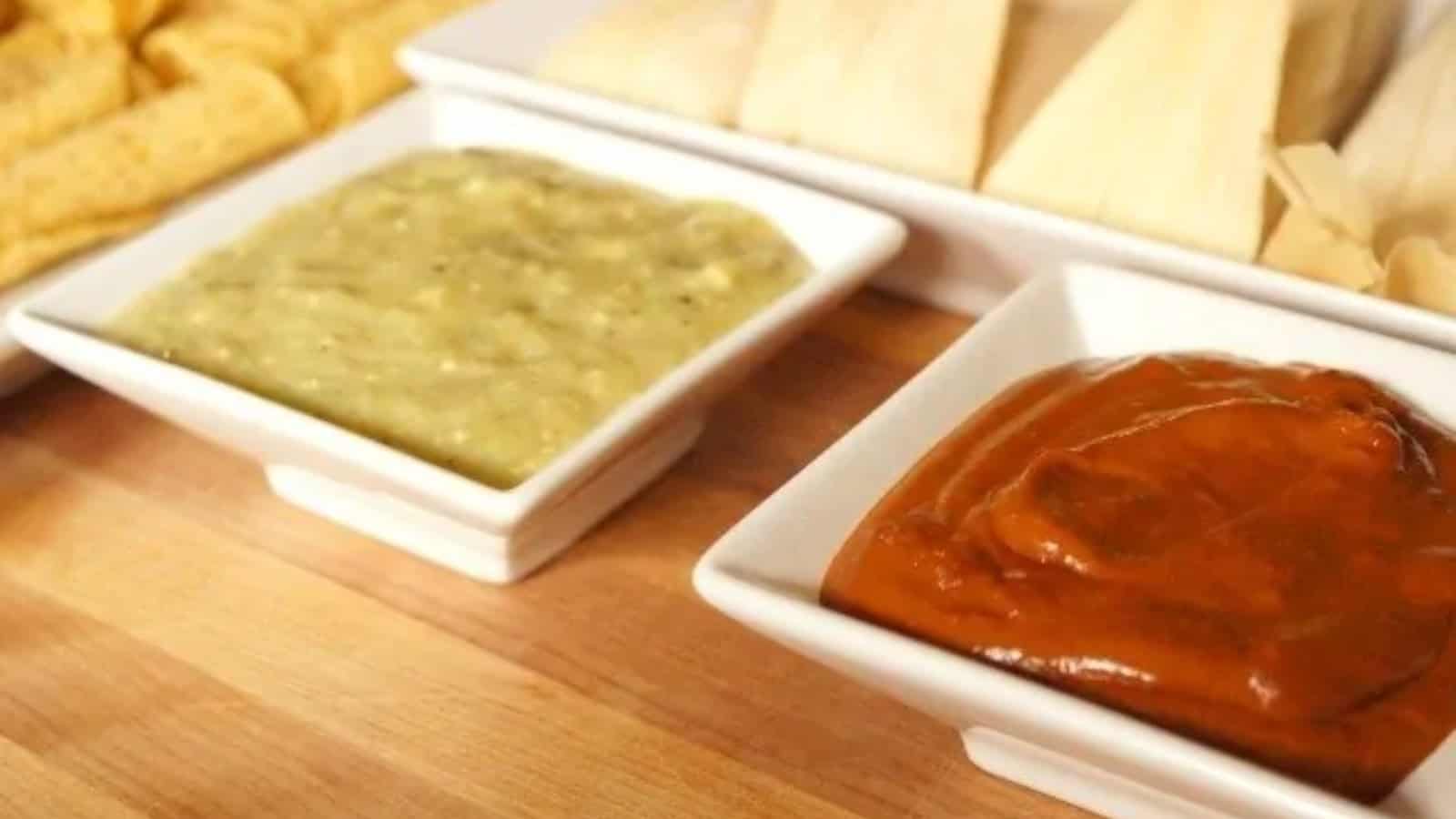 Image shows a taquito dipping into a white bowl of Roasted Tomatillo Salsa.