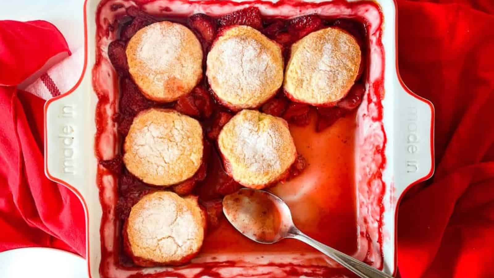 A shot of cobbler with a spoonful taked out of it.