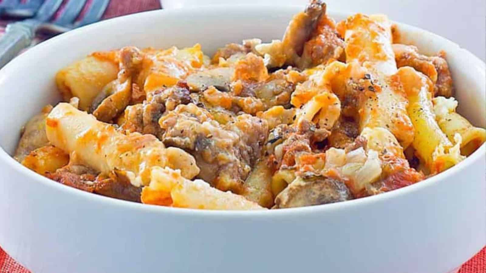 Baked ziti pasta casserole topped with melted cheese and rich tomato sauce.